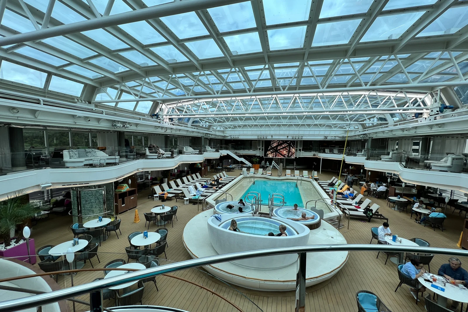 The Lido pool under the retractable glass dome on a Holland America ship in Alaska