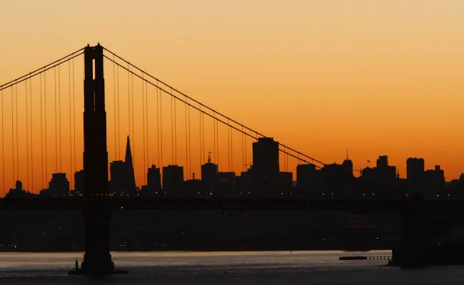Sunset view of the Golden Gate Bridge with San Francisco in the background