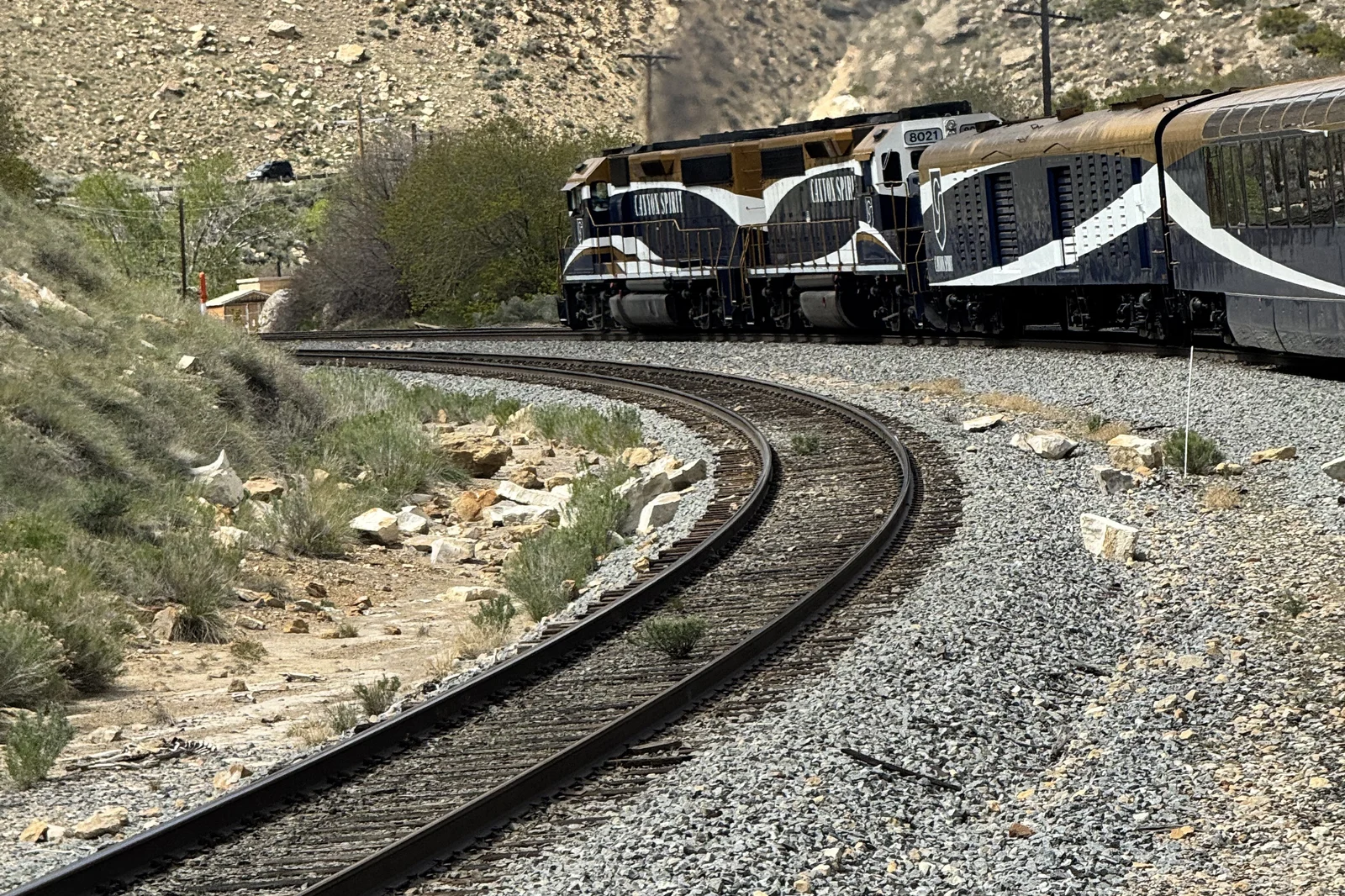 Canyon Spirit locomotives rounding a curve through canyon country in Utah