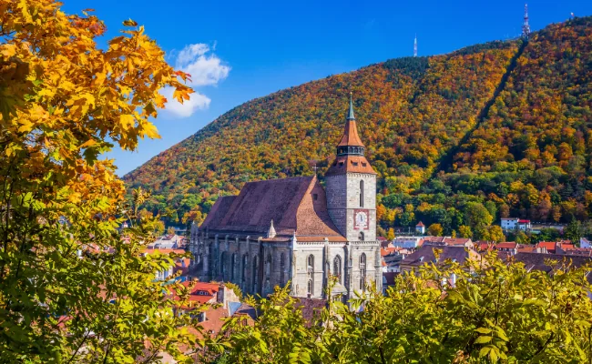 Building in the fall leaves in Brasov
