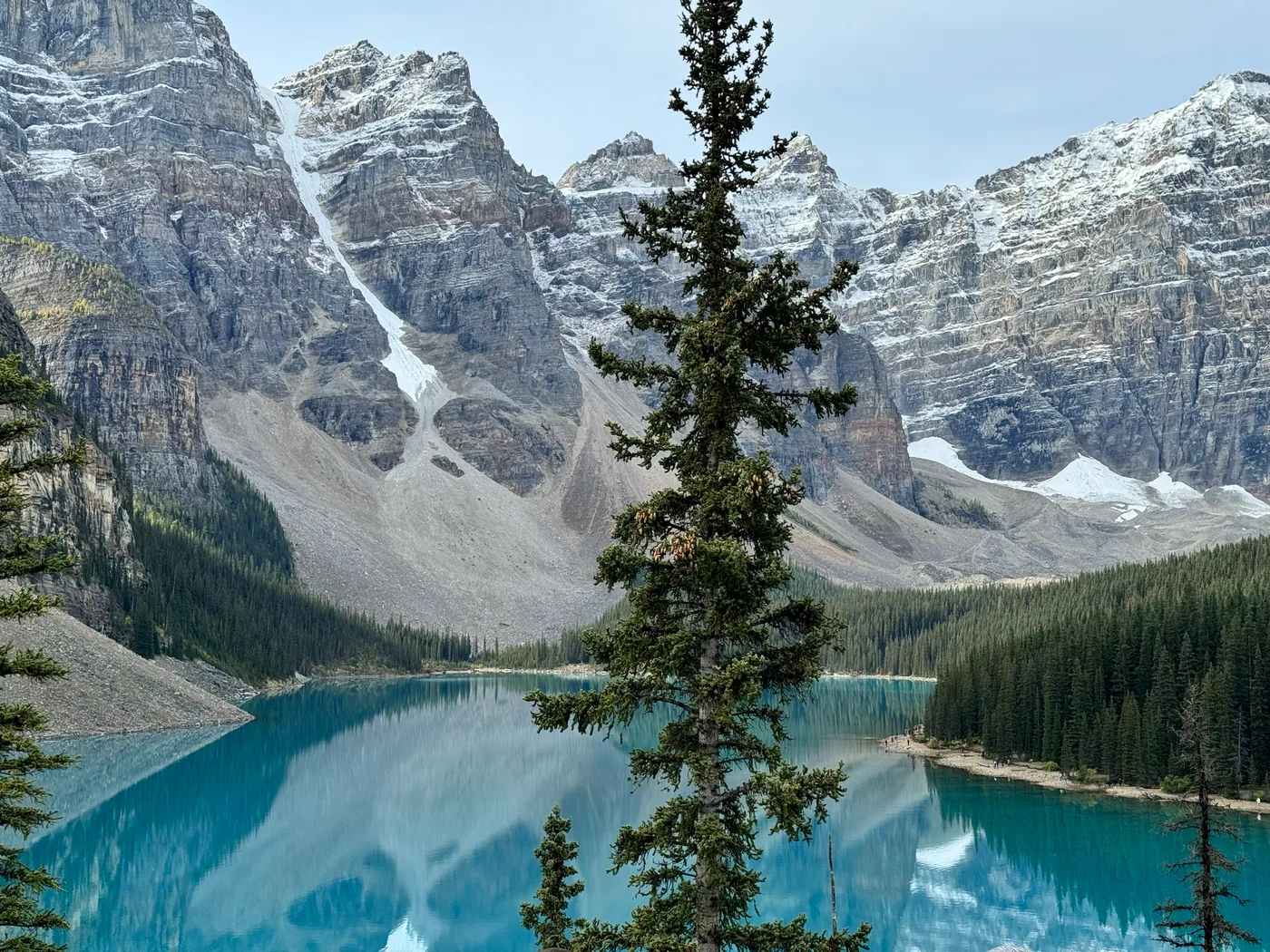 Moraine Lake in Banff, turquoise water below the snow-dusted Valley of the Ten Peaks, a stop on a Rocky Mountaineer land tour.