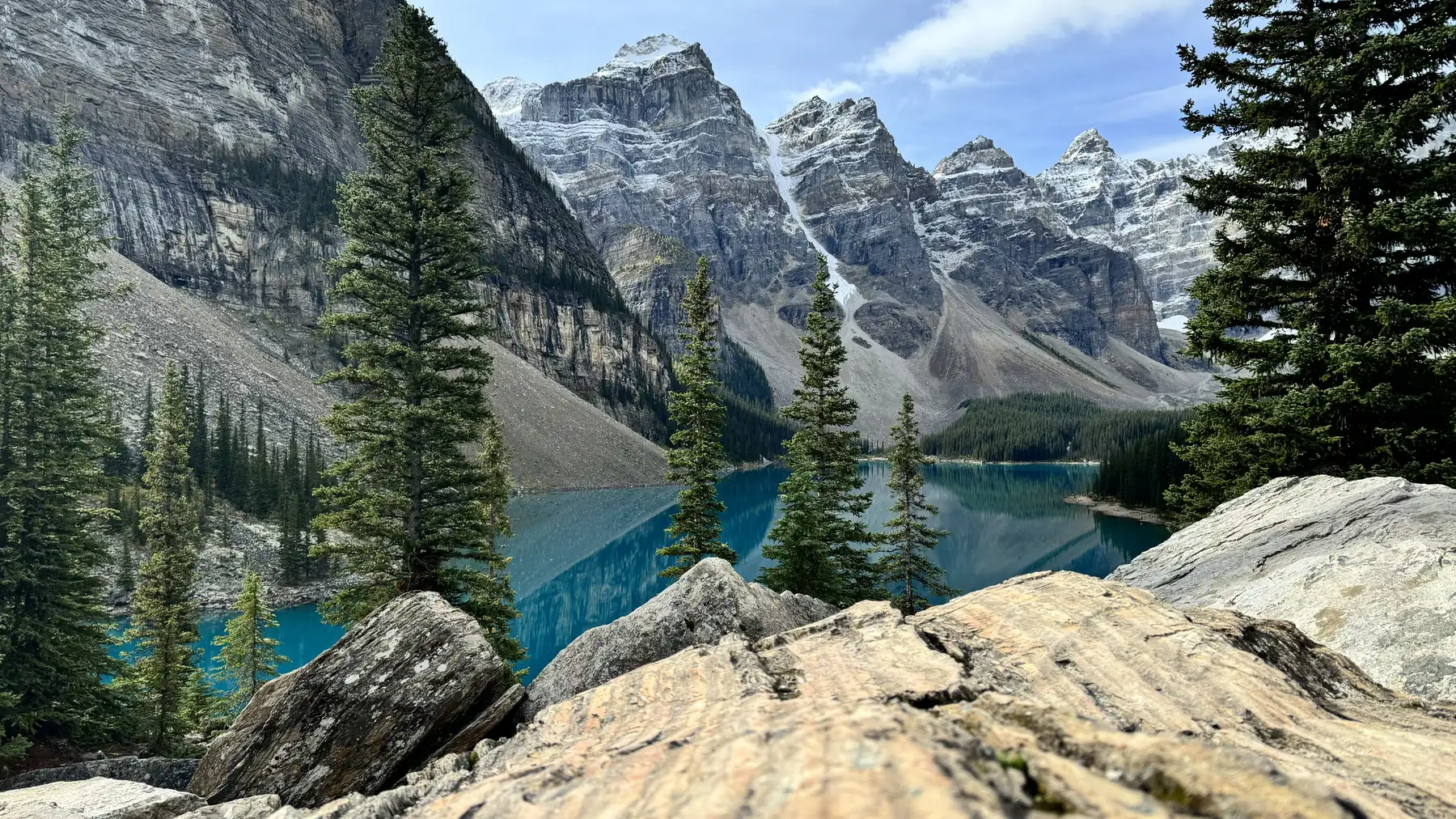 Turquoise Moraine Lake below the snow-dusted peaks of the Valley of the Ten Peaks in the Canadian Rockies